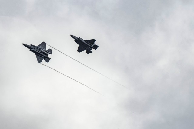 Two Air Force F-35 Lightning II aircraft assigned to the 34th Fighter Squadron fly over the 86th Air Base in Romania, Feb. 24, 2022.
