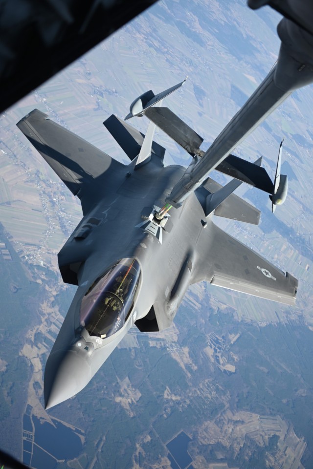 An Air Force F-35 Lightning II aircraft assigned to the 34th Fighter Squadron receives fuel from a KC-10 Extender aircraft over Poland, Feb. 24, 2022.