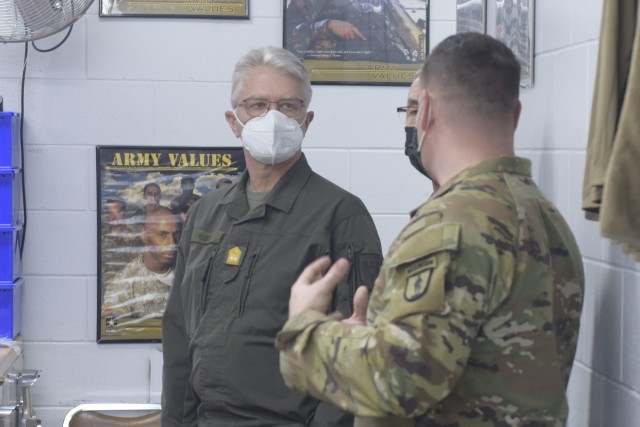 U.S. Army Lt. Col. Steve Gagner, commander, Army Mountain Warfare School, 124th Regiment (Regional Training Institute), Vermont National Guard, escorts an Austrian military delegation through the AMWS at Camp Ethan Allen Training Site, Jericho,...