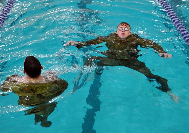 Service members from the Defense Language Institute Foreign Language Center and Naval Postgraduate School took the 100-meter swim test for the German Armed Forces Badge for Military Proficiency at the Monterey Sports Center, Monterey, Calif., Sept. 10, 2021. 