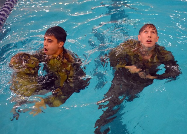 Service members from the Defense Language Institute Foreign Language Center and Naval Postgraduate School took the 100-meter swim test for the German Armed Forces Badge for Military Proficiency at the Monterey Sports Center, Monterey, Calif.,...