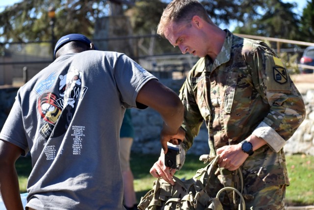 Spc. Daniel Lewis, assigned to the 229th Military Intelligence Battalion, weighs his ruck during the ruck-march test for the German Armed Forces Badge for Military Proficiency at the Naval Postgraduate School, Monterey, Calif., Oct. 9, 2021. Carrying a 33-pound rucksack, participants marched 3.75 miles in 60 minutes or less to qualify for the bronze-level badge, 5.6 miles in 90 minutes or less for silver, and 7.5 miles in 120 minutes or less for gold.