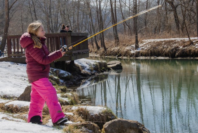 Tenley Nevins casts her fishing pole into the spring branch located at Stone Mill Spring Recreation Area during the Kids’ Trout Fishing Derby held Feb. 26.