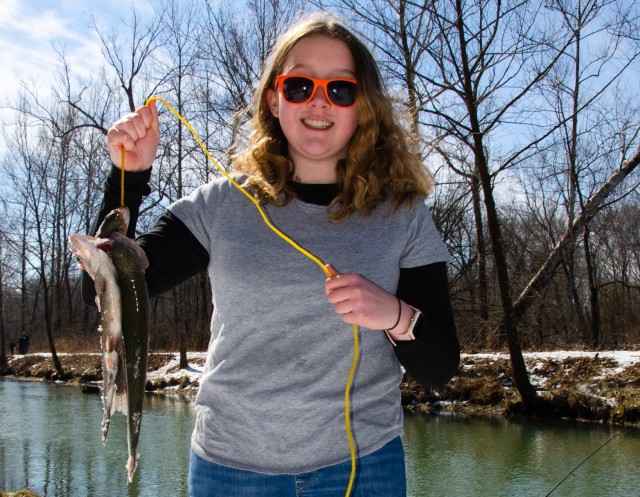Shelby Cannon shows off her catch at the Kids’ Trout Fishing Derby held Feb. 26 at Stone Mill Spring Recreation Area.