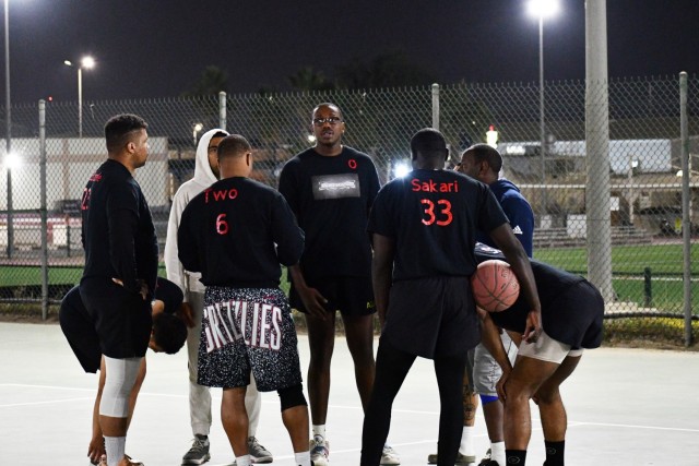 Spc Addison Burgess, a human resources specialist assigned to the Fort Bragg, N.C., based 3rd Expeditionary Sustainment Command talks with members of the “Most Hated,” a basketball team he helped coach in the basketball league at Camp Arifjan, Kuwait. Burgess also serves as the coach of the Fayetteville Stars back at his home station. The team competes in a 16u and 17u basketball league and has traveled across the country. Burgess said he sees the team as more as an outreach program within the local Fort Bragg area.