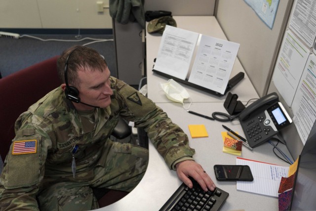 Staff Sgt. Steven San Antonio of the 195th Regional Training Institute answers a call Feb. 14, 2022, at the St. Joseph COVID triage call center in Nashua, New Hampshire. San Antonio is one of two New Hampshire Guardsmen assigned to the center as...