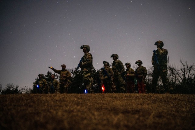 Mission Sustainment Team students use AN/PVS-31A binocular night-vision goggles during a field exercise in Oklahoma City Feb. 10, 2022. The students used the night vision devices to learn how to observe their surroundings and conceal their...
