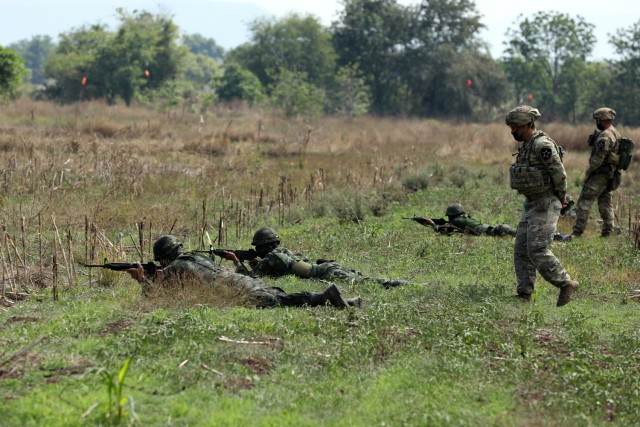U.S. Army infantrymen with the 4th Battalion, 23rd Infantry Regiment, 2nd Stryker Brigade Combat Team, 7th Infantry Division, instructs a team of soldiers from the 112th Infantry Regiment, Royal Thai Army, during a dismount training exercise during Cobra Gold 2022 in the Lopburi Province of the Kingdom of Thailand, Feb. 26, 2022. CG 22 is the 41st iteration of the international training exercise that supports readiness and emphasizes coordination on civic action, humanitarian assistance, and disaster relief. From Feb. 22 through March 4, 2022, this annual event taking place at various locations throughout the Kingdom of Thailand increases the capability, capacity, and interoperability of partnered nations while simultaneously reinforcing our commitment to a free and open Indo-Pacific. (U.S. Army photo by Spc. Andrew Mendoza)