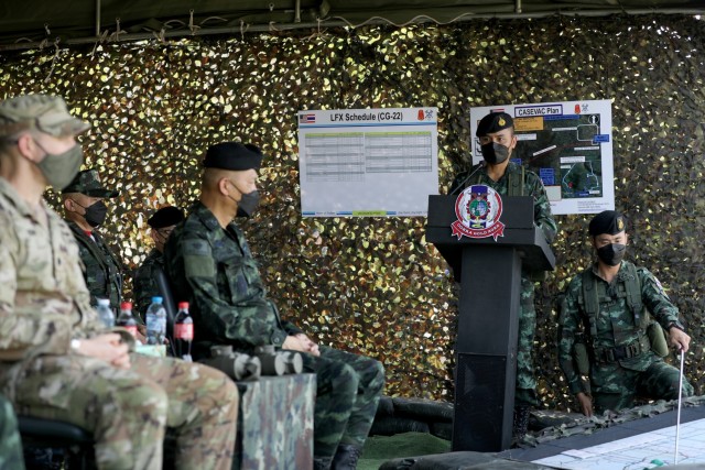 U.S. Army Lt. Col. Duke Reim (left), the commander of the 4th Battalion, 23rd Infantry Regiment, 2nd Stryker Brigade Combat Team, 7th Infantry Division and Royal Thai Armed Forces Deputy Chief of Defense Forces Gen. Supachok Thawatperachai (left of center), listen to a dry fire briefing plan as part of Cobra Gold 2022 in the Lopburi Province of the Kingdom of Thailand, Feb. 26, 2022. CG 22 is the 41st iteration of the international training exercise that supports readiness and emphasizes coordination on civic action, humanitarian assistance, and disaster relief. From Feb. 22 through March 4, 2022, this annual event taking place at various locations throughout the Kingdom of Thailand increases the capability, capacity, and interoperability of partnered nations while simultaneously reinforcing our commitment to a free and open Indo-Pacific. (U.S. Army photo by Spc. Andrew Mendoza)