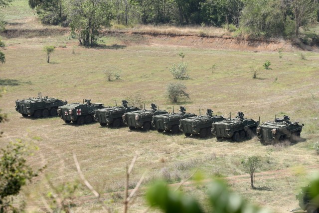 U.S. Army infantrymen with the 4th Battalion, 23rd Infantry Regiment, 2nd Stryker Brigade Combat Team, 7th Infantry Division, Stage their vehicles in preparation to train members of the 112th Infantry Regiment, Royal Thai Army, on the M1129 Stryker Mortar system as part of Cobra Gold 2022 in the Lopburi Province of the Kingdom of Thailand, Feb. 26, 2022. CG 22 is the 41st iteration of the international training exercise that supports readiness and emphasizes coordination on civic action, humanitarian assistance, and disaster relief. From Feb. 22 through March 4, 2022, this annual event taking place at various locations throughout the Kingdom of Thailand increases the capability, capacity, and interoperability of partnered nations while simultaneously reinforcing our commitment to a free and open Indo-Pacific. (U.S. Army photo by Spc. Andrew Mendoza)