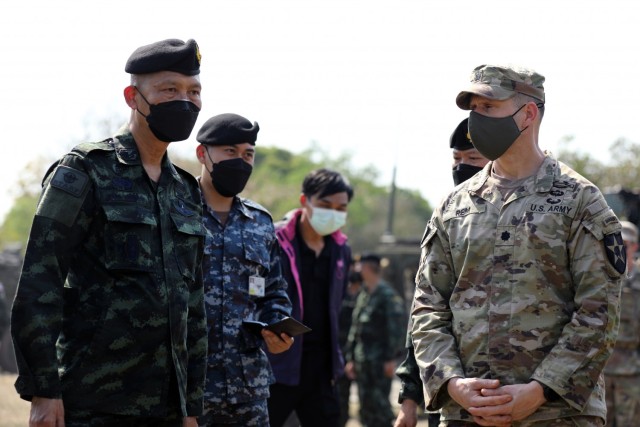 U.S. Army Lt. Col. Duke Reim (right), the commander of the 4th Battalion, 23rd Infantry Regiment, 2nd Stryker Brigade Combat Team, 7th Infantry Division, and Royal Thai Armed Forces Deputy Chief of Defense Forces Gen. Supachok Thawatperachai (left) discuss vehicle inspections as part of Cobra Gold 2022 in the Lopburi Province of the Kingdom of Thailand, Feb. 26, 2022. CG 22 is the 41st iteration of the international training exercise that supports readiness and emphasizes coordination on civic action, humanitarian assistance, and disaster relief. From Feb. 22 through March 4, 2022, this annual event taking place at various locations throughout the Kingdom of Thailand increases the capability, capacity, and interoperability of partnered nations while simultaneously reinforcing our commitment to a free and open Indo-Pacific. (U.S. Army photo by Spc. Andrew Mendoza)
