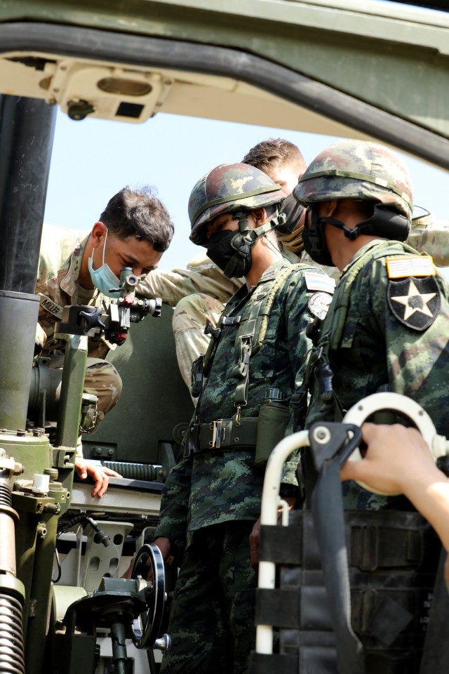 Army Spc. Derrek Miller, an infantryman with the 4th Battalion, 23rd Infantry Regiment, 2nd Stryker Brigade Combat Team, 7th Infantry Division, trains members of the 112th Infantry Regiment, Royal Thai Army, by inspecting their elevation calculations on the M1129 Stryker Mortar system as part of Cobra Gold 2022 in the Lopburi Province of the Kingdom of Thailand, Feb. 26, 2022. CG 22 is the 41st iteration of the international training exercise that supports readiness and emphasizes coordination on civic action, humanitarian assistance, and disaster relief. From Feb. 22 through March 4, 2022, this annual event taking place at various locations throughout the Kingdom of Thailand increases the capability, capacity, and interoperability of partnered nations while simultaneously reinforcing our commitment to a free and open Indo-Pacific. (U.S. Army photo by Spc. Andrew Mendoza)