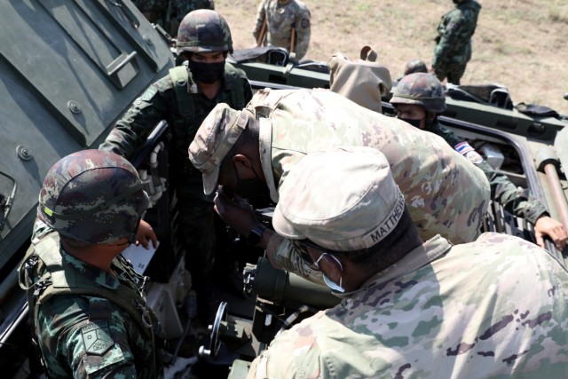 Army Spc. Alveno Mathews and Spc. James Martin, infantrymen with the 4th Battalion, 23rd Infantry Regiment, 2nd Stryker Brigade Combat Team, 7th Infantry Division, train members of the 112th Infantry Regiment, Royal Thai Army, in the use of the M1129 Stryker Mortar system as part of Cobra Gold 2022 in the Lopburi Province of the Kingdom of Thailand, Feb. 26, 2022. Cobra Gold 2022 is the 41st iteration of the international training exercise that supports readiness and emphasizes coordination on civic action, humanitarian assistance, and disaster relief. From Feb. 22 through March 4, 2022, this annual event taking place at various locations throughout the Kingdom of Thailand increases the capability, capacity, and interoperability of partnered nations while simultaneously reinforcing our commitment to a free and open Indo-Pacific. (U.S. Army photo by Spc. John R. Reed)