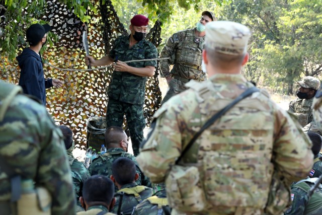 A soldier with the Royal Thai Army Special Warfare Command gives a lesson in jungle survival training about drinking from a vine as part of Cobra Gold 2022 in the Lopburi Province of the Kingdom of Thailand, Feb. 26, 2022. CG 22 is the 41st iteration of the international training exercise that supports readiness and emphasizes coordination on civic action, humanitarian assistance, and disaster relief. From Feb. 22 through March 4, 2022, this annual event taking place at various locations throughout the Kingdom of Thailand increases the capability, capacity, and interoperability of partnered nations while simultaneously reinforcing our commitment to a free and open Indo-Pacific. (U.S. Army photo by Spc. Andrew Mendoza)