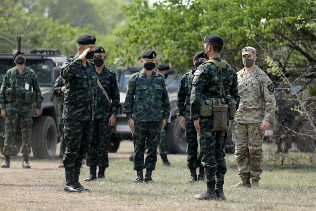 Royal Thai Armed Forces Deputy Chief of Defense Forces Gen. Supachok Thawatperachai (left of center), salutes a member of the 112th Infantry Regiment, Royal Thai Army as part of Cobra Gold 2022 in the Lopburi Province of the Kingdom of Thailand, Feb. 28, 2022. CG 22 is the 41st iteration of the international training exercise that supports readiness and emphasizes coordination on civic action, humanitarian assistance, and disaster relief. From Feb. 22 through March 4, 2022, this annual event taking place at various locations throughout the Kingdom of Thailand increases the capability, capacity, and interoperability of partnered nations while simultaneously reinforcing our commitment to a free and open Indo-Pacific. (U.S. Army photo by Spc. Andrew Mendoza)