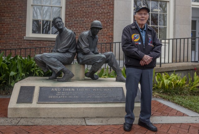 WWII hero in front of Clemson WWII monument