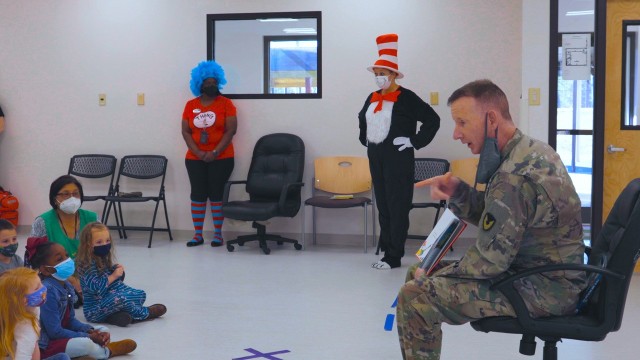Garrison Commander Col. Glenn Mellor reads “Green Eggs and Ham” by Dr. Seuss during a live reading event on National Read Across America Day at the Goss Road Child Development Center. 