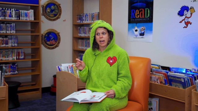 Misty Glover, from PEO Missiles and Space, reads “How the Grinch Stole Christmas” by Dr. Seuss during a taping session for Team Redstone’s Read Across America effort. A total of 35 videos were sent to the local school system featuring readers from across the Arsenal reading their favorite children’s book. 