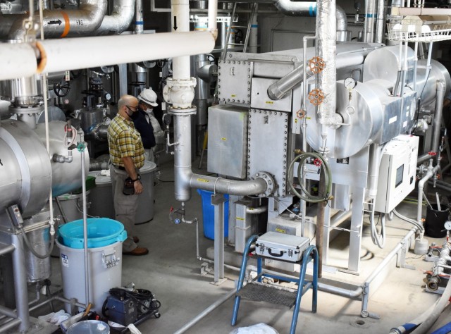 U.S. Army Garrison Japan staff and contractors work to repair an air conditioner in Building 1050 at Camp Zama, Japan, Aug. 6, 2020. Garrison officials have recently requested personnel to efficiently use utilities to not only lower costs, but to...