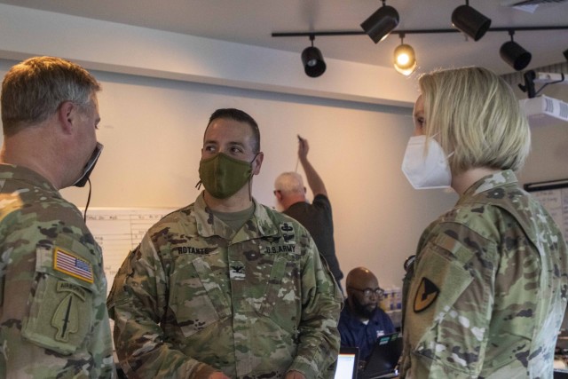 Col. John C. Rotante, 404th Army Field Support Brigade commander (center), Col. Erik C. Johnson, 402nd AFSB commander (left), and Lt. Col. Emily S. Poole, 404th AFSB executive officer (right), discuss strategic level sustainment in support of ...