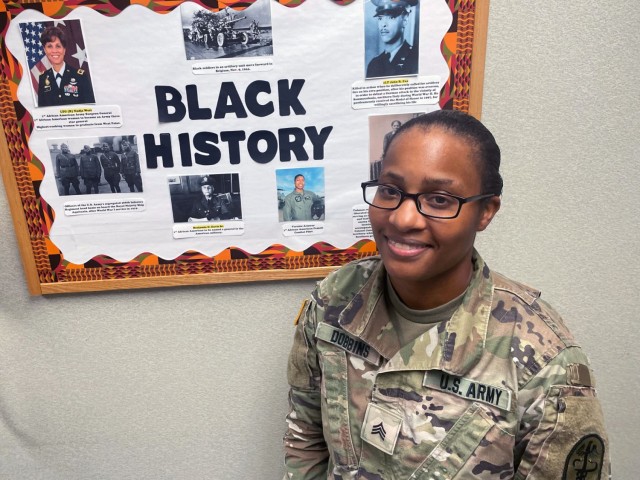 Sgt. Michelle Dobbins, a pharmacy technician is promoting unity in her workplace with a simple presentation of interesting facts (photo by Lesley Atkinson, Kenner Army Health Clinic, PAO).
