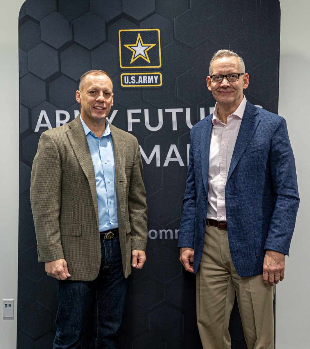 Lt. Gen. Scott McKean, right, deputy commanding general, U.S. Army Futures Command and director, Futures and Concepts Center, and Maj. Gen. Dennis LeMaster, commanding general, U.S Army Medical Center of Excellence, pose for a photo on Mar. 4, 2022 at AFC headquarters, Austin, Texas. McKean signed the Army Futures Command Concept for Medical 2028 with AFC and Army medical leaders in attendance. The Army Futures Command Concept for Medical 2028 describes changes to what and how the Army Health System will enable and sustain multi-domain operations against peer and near-peer competitors in the 2028 timeframe. (Photo Credit: Courtesy Photo)
