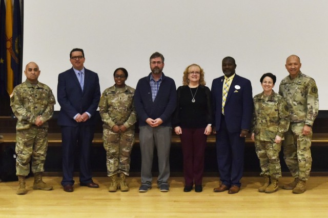 Brig. Gen. Hope Rampy, 62nd Adjutant General of the Army (second from right), visited Fort Leonard Wood this week and presented coins to four exceptional human resources professionals here this morning: 1st Lt. Lonnae Williams, 3rd Chemical Brigade adjutant (third from left), Joe Reynolds, Maneuver Support Center of Excellence officer strength manager (center left), Cindy Drue, MSCoE enlisted strength manager (center right), and Eric Adams, chief of the Casualty Assistance Center and the ID Card facility (third from right). Also pictured are: Lt. Col. Angel Vega, MSCoE G-1 (left), Mike Beando, Human Resources director, and Sgt. Maj. Jon Williams, Sergeant Major for the Adjutant General (right). The Adjutant General of the Army, commonly called the TAG, is the chief administrative officer of the U.S. Army, responsible for the procedures affecting the preservation of all Army personnel records, military awards and decorations, casualty operations and transition services. As the TAG, Rampy also serves as commanding general of the U.S. Army Physical Disability Agency and executive director of the Military Postal Service Agency.