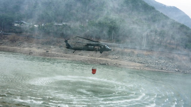 A 2nd Combat Aviation Brigade UH-60 Blackhawk helicopter lifts off from a reservoir near Daegu, South Korea March 11, 2022. U.S. Forces Korea service members and first responders worked in tandem with Republic of Korea personnel to fight wildfires in the Daegu region.