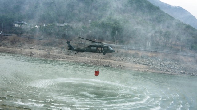 A 2nd Combat Aviation Brigade UH-60 Blackhawk helicopter lifts off from a reservoir near Daegu, South Korea March 11, 2022. U.S. Forces Korea service members and first responders worked in tandem with Republic of Korea personnel to fight wildfires...