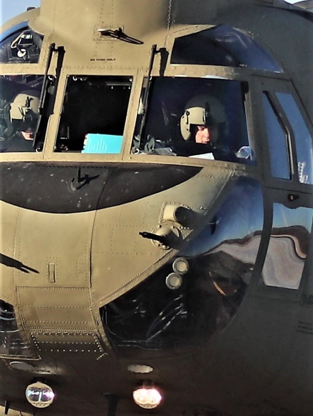 Crew guides CH-47 Chinook for sling-load training support at Fort McCoy