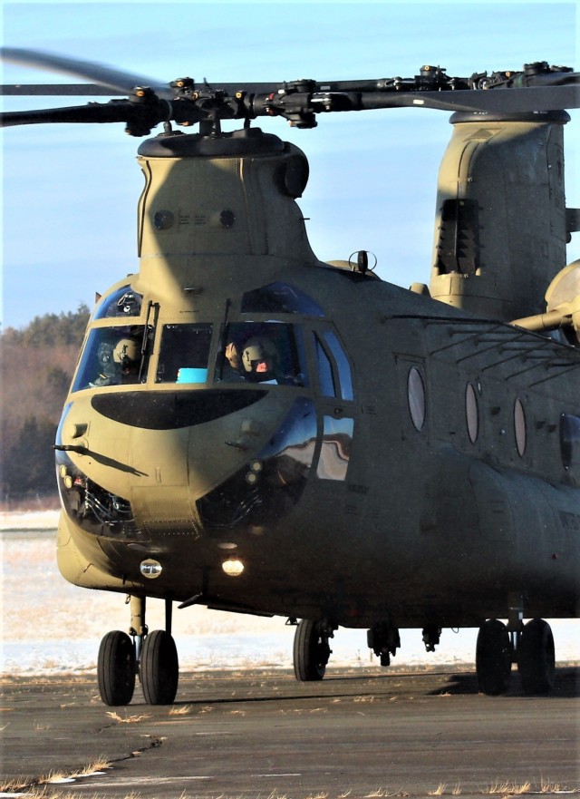 Crew guides CH-47 Chinook for sling-load training support at Fort McCoy