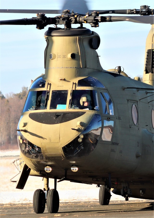 Crew guides CH-47 Chinook for sling-load training support at Fort McCoy