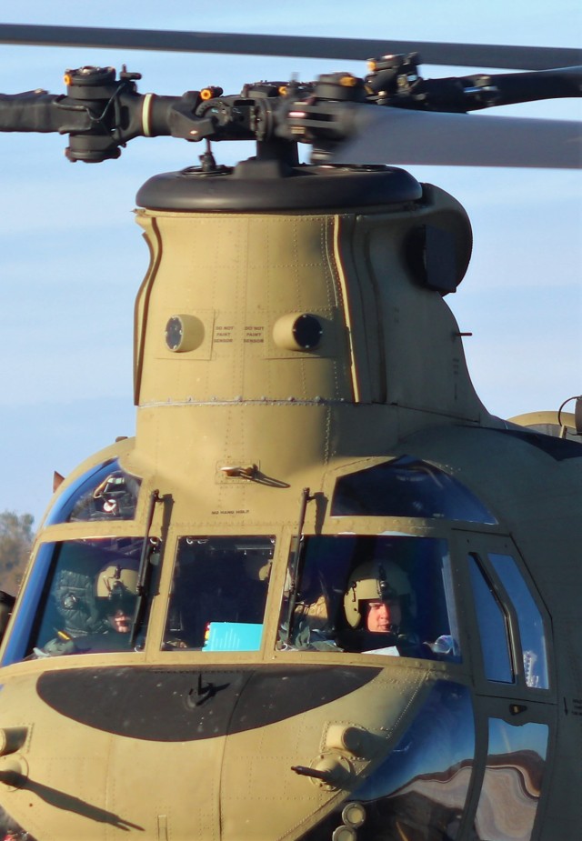 Crew guides CH-47 Chinook for sling-load training support at Fort McCoy