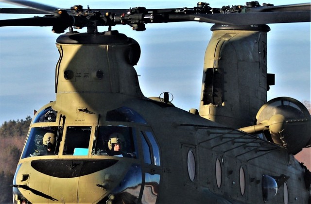 Crew guides CH-47 Chinook for sling-load training support at Fort McCoy