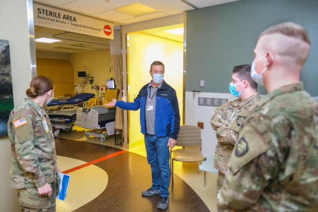 Hospital Facilities Operations Manager Don Wilder gives Oregon Army National Guard hospital relief mission members a tour of West Valley Hospital in Dallas, Oregon, Jan. 18, 2022, as part of the team's first-day orientation.The Guard is ending...