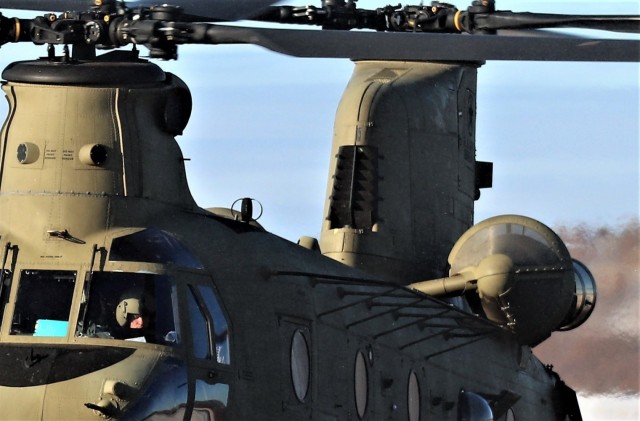 Crew guides CH-47 Chinook for sling-load training support at Fort McCoy