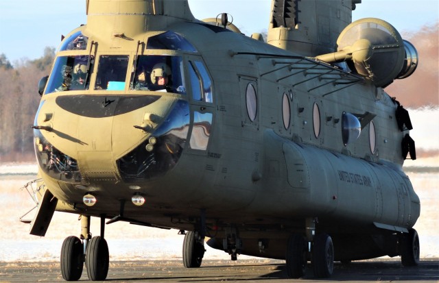 Crew guides CH-47 Chinook for sling-load training support at Fort McCoy