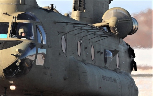 Crew guides CH-47 Chinook for sling-load training support at Fort McCoy