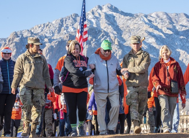 Col. Ben Skardon, a 1938 graduate of Clemson University, WWII POW, recipient of two Silver Stars, and survivor of the Bataan Death March, walks with &#34;Ben&#39;s Brigade&#34; in the Bataan Memorial Death March at White Sands Missile Range, N.M., March 17, 2019. Skardon came to White Sands to walk in the march for the 12th time. He is 101 years old, and the only survivor of the actual death march to walk in the memorial march. (Photo by Ken Scar)