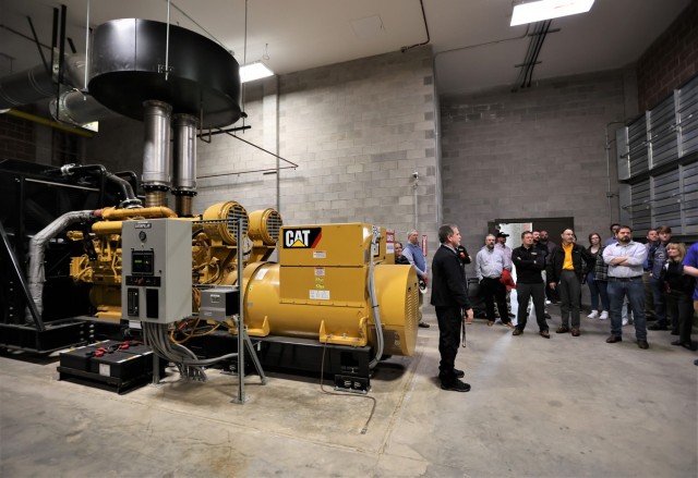 University of Kentucky staff and students ask questions about the Fort Knox Energy Program while viewing installation diesel generators March 16, 2022.