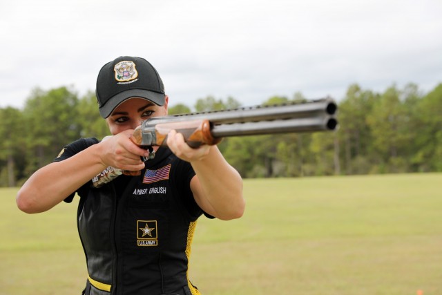 Army 1st Lt. Amber English poses for a photo while wielding her shotgun, May 6, 2019.
