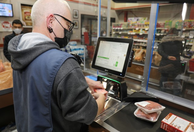 Bacardi Stukey, store associate at the commissary on Camp Zama, Japan, scans grocery items with an upgraded electronic scanning register March 22, 2022. The new systems are part of a Defense Commissary Agency-wide update to replace aging systems with state-of-the-art technology that meets current grocery industry standards. 