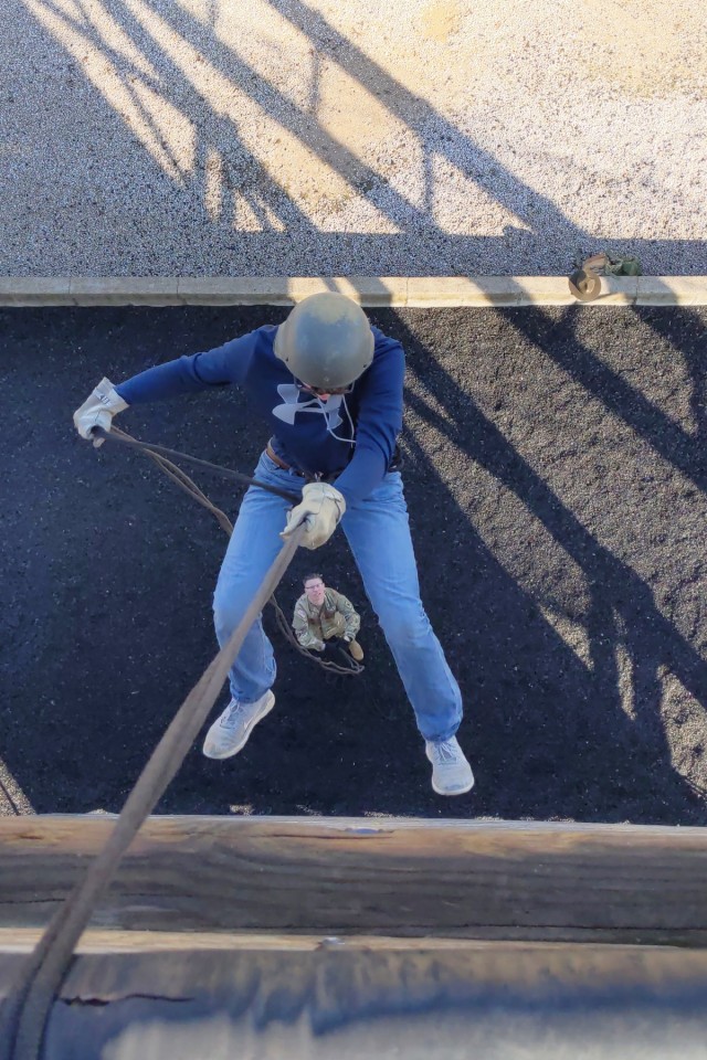 Matthew Marlow, from Laquey, Missouri’s undefeated junior high school basketball team, rappels down Fort Leonard Wood’s 47-foot-tall Warrior Tower Saturday with the help of Staff Sgt. Winston Jordan, from Company E, 701st Military Police...