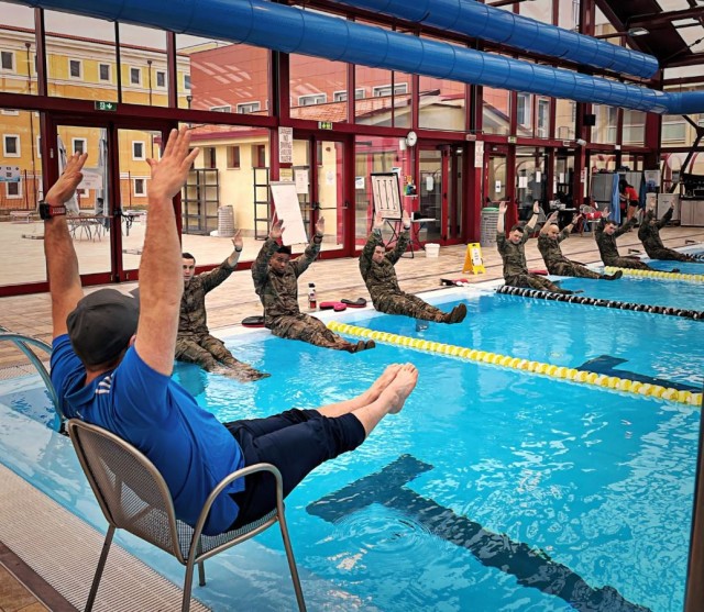 Josh Grant, a tactical strength and conditioning coach from the U.S. Army Garrison Italy’s Directorate of Family, Morale Welfare and Recreation, conducts a lesson on swimming techniques with paratroopers, March 8, 2022, at the Caserma Ederle...