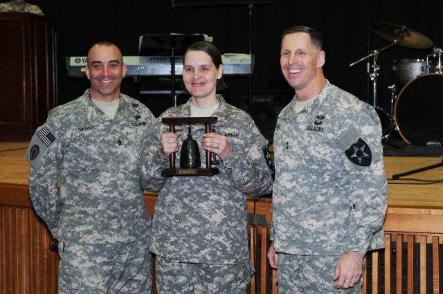 Sgt Maj. Petra M. Casarez (center), from Headquarters and Headquarters Battalion, 2nd Infantry Division, a logistic maintenance sergeant major received accolades in 2014 from Maj. Gen. Thomas Vandal, 2nd Inf. Div., commanding general, Command Sgt. Maj. Andrew Spano.  