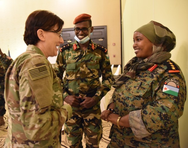 Army 1st Sgt. Marissa Lowe, left, the senior human resources noncommissioned officer with the Kentucky Army National Guard’s 63rd Theater Aviation Brigade, talks with a female Djiboutian officer during a State Partnership Program planning conference at Kempinski Palace, Djibouti City, Djibouti, March 8, 2022. (Photo provided)