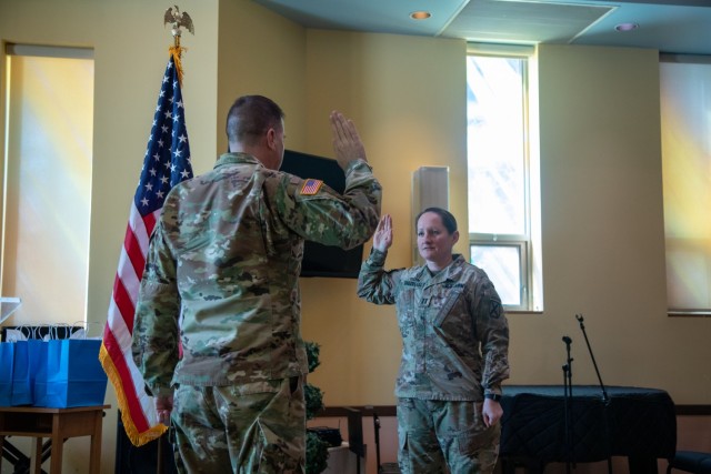 Chaplain (Maj.) Tanya Bindernagel, assigned to the 10th Mountain Division Sustainment Brigade, 10th Mountain Division, raises her hand during the Oath of the Commissioned Officer during her promotion ceremony, March 14, 2022, on Fort Drum, New York. (U.S. Army photo by Sgt. 1st Class Neysa Canfield, 10th MDSB Public Affairs Office)
