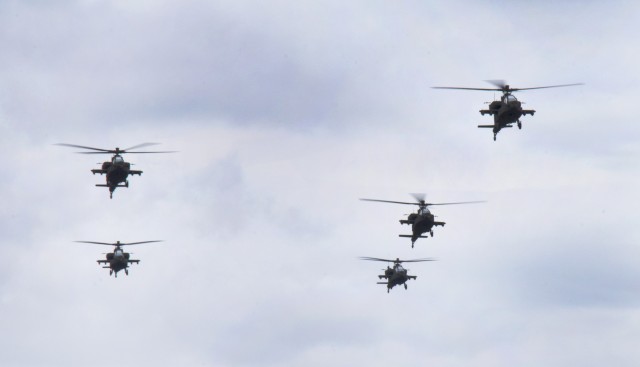 The first five AH-64E model Apache attack helicopters to be delivered to the South Carolina National Guard arrive at McEntire Joint National Guard Base, South Carolina, March 24, 2022. The South Carolina National Guard is replacing 24 D-model aircraft with the new E-model, which will be delivered to and flown by the 1-151st Attack Reconnaissance Battalion. (U.S. Army National Guard photo by Staff Sgt. Brad Mincey, South Carolina National Guard)