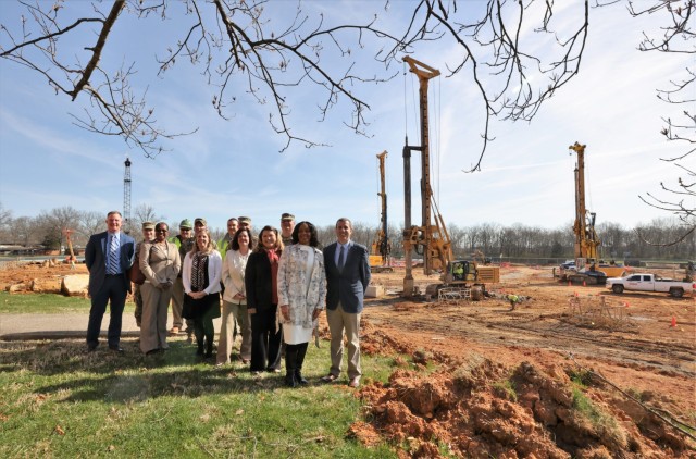 Fort Knox leaders pose with members of the Army Corps of Engineers and the Department of Defense Education Activity at the construction site of the new Van Voorhis Elementary School March 28, 2022.
