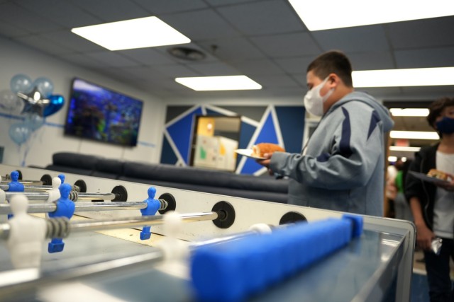 A USAG Daegu youth walks in front of a foosball table at a newly renovated Camp Walker teen center, March 25, 2022. The teen center was designed using input provided by USAG Daegu teenagers.